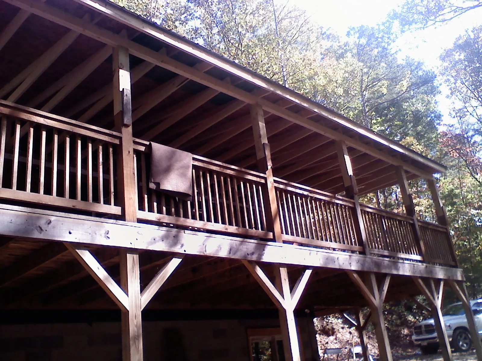 Timber framing under a new elevated porch and deck — Roof Leak Repair in West Salisbury by Roofing Brothers